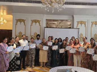 School leaders holding certificates of participation for educational tour seminar