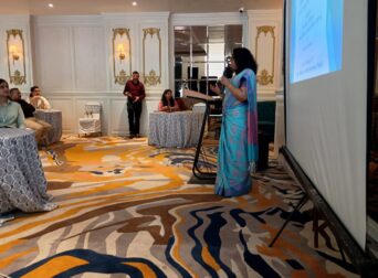 Founder conducting seminar on educational tours for school principals