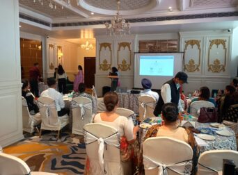 School principals attending an educational tour seminar, view from the back